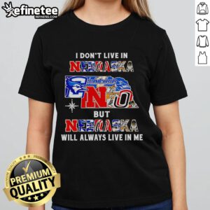 Official 'I Dont Live in Nebraska but Nebraska Will Always Live in Me' ladies tee featuring sport teams design.
