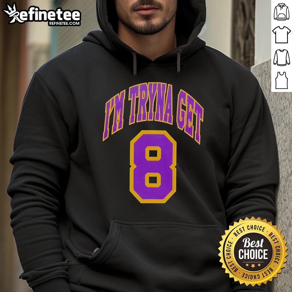 Alt Text: Kehlani wearing an official 'I'm Tryna Get Los Angeles Lakers 8' hoodie, showcasing stylish fan apparel.