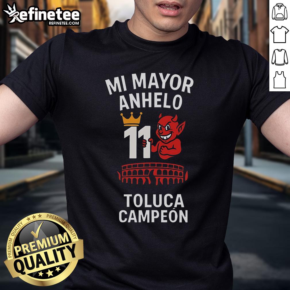 Alt Text: Official Playera Tirando Rostro Mi Mayor Anhelo 11 Toluca Campen T-Shirt featuring vibrant team graphics and colors.