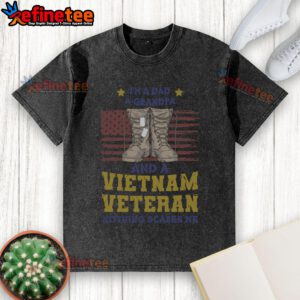 Alt Text: Awesome I'm a Dad, a Grandpa, and a Vietnam Veteran Nothing Scares Me washed t-shirt displayed on a wooden background.