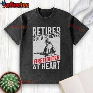 Awesome retired but a forever firefighter at heart washed t-shirt displayed on a rustic wooden background.