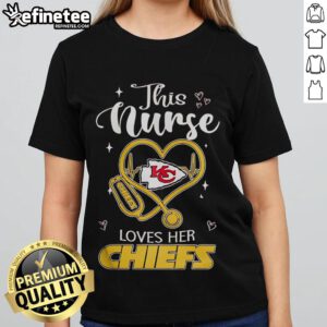 Happy nurse wearing Kansas City Chiefs ladies tee, showcasing team spirit and love for football in her cheerful demeanor.
