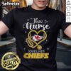 Happy nurse wearing a Kansas City Chiefs t-shirt, showcasing team spirit and love for football.