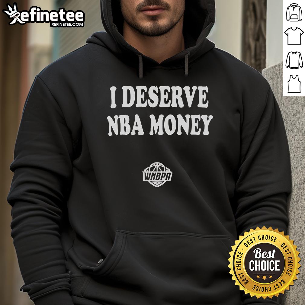 Caitlin Clark wearing a stylish WNBA hoodie with 'I Deserve NBA Money' slogan, showcasing her support for equality.