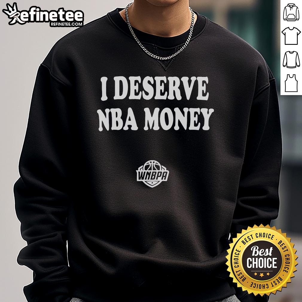Caitlin Clark wearing a stylish 'I Deserve NBA Money' sweatshirt, showcasing WNBA pride and support for women's basketball.