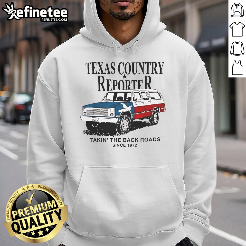 Nice Texas country reporter taking the back roads since 1972 in an American flag hoodie, showcasing Texas pride.