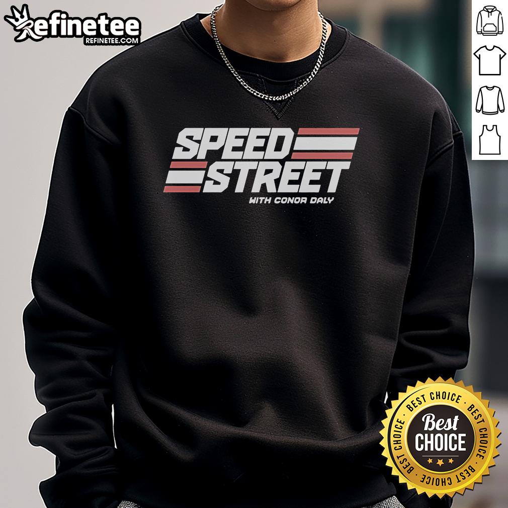 Conor Daly wearing a Top Speed Street sweatshirt, showcasing style and speed at a racing event.
