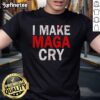 Alt Text: Official Make Maga Cry T-Shirt featuring bold text design in red and white on a black fabric background.