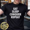 Top Eat Sleep Conquer Repeat T-Shirt design featuring motivational text in a bold, stylish font on a casual tee.