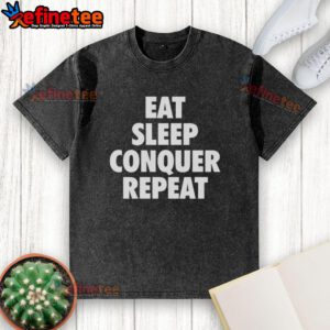 Top Eat Sleep Conquer Repeat washed t-shirt in a casual setting, showcasing the trendy design and vibrant colors.