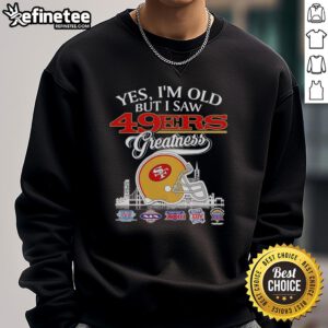 Vintage sweatshirt featuring San Francisco 49ers helmet and skyline, celebrating team greatness for fans and collectors.