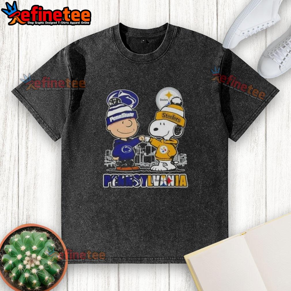 Happy Charlie Brown in Penn State Nittany Lions x Snoopy design on Pittsburgh Steelers skyline washed t-shirt.