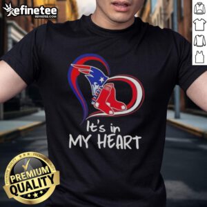 Alt Text: Premium 'It's In My Heart' t-shirt featuring the England Patriots and Boston Red Sox logos, perfect for sports fans.