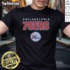 Alt Text: Premium Philadelphia 76ers throwback t-shirt featuring classic team logo and vibrant retro colors, perfect for fans.