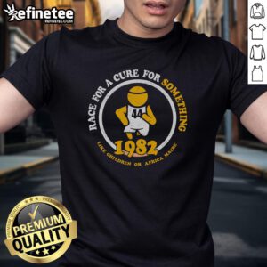 1982 Premium Race For A Cure T-Shirt featuring a vibrant design supporting children's health in Africa.