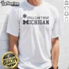 Top Asterisk Still Can't Beat Michigan Wolverines T-Shirt featuring bold graphics and vibrant colors for fans.