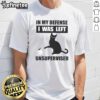 Funny cat T-shirt featuring the phrase In My Defense I Was Left Unsupervised, perfect for cat lovers and humor enthusiasts.