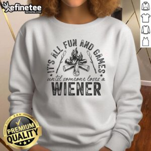 Funny camping sweatshirt reading 'All fun and games until someone loses a weiner' for outdoor enthusiasts and humor lovers.