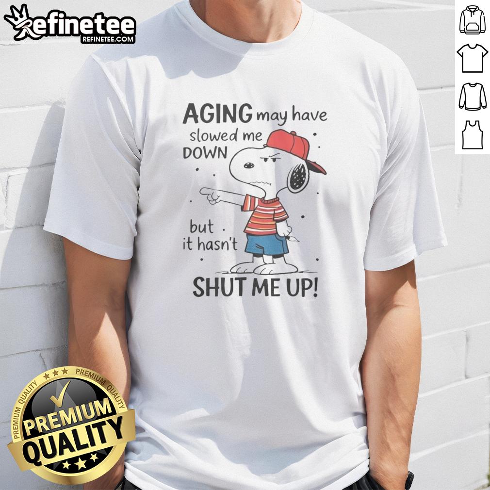 Funny Snoopy Aging May Have Slowed Me Down But It Hasn'T Shut Me Up T-Shirt featuring a playful Snoopy graphic.
