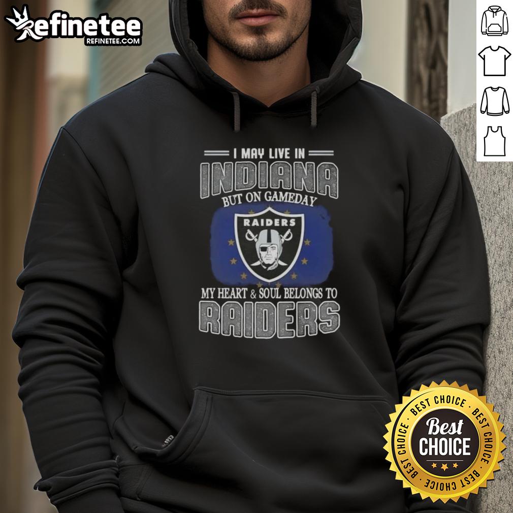 Person wearing a Raiders hoodie, showcasing team spirit in Indiana on game day, with a passionate expression.