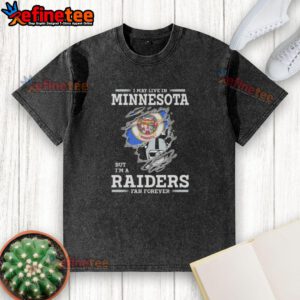 Hot I May Live in Minnesota But I'm A Raiders Fan Forever washed t-shirt featuring bold Raiders graphics and vintage style.