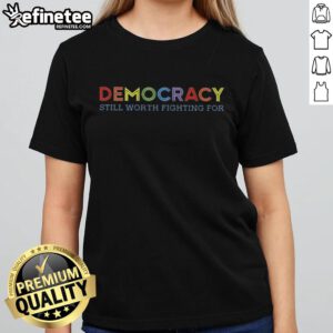 Ladies tee featuring 'Nice Democracy Still Worth Fighting For' slogan, promoting civic engagement and advocacy.
