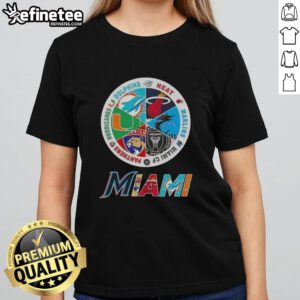 Ladies tee featuring logos of Miami sports teams: Dolphins, Heat, Marlins, Miami FC, Panthers, and Hurricanes.