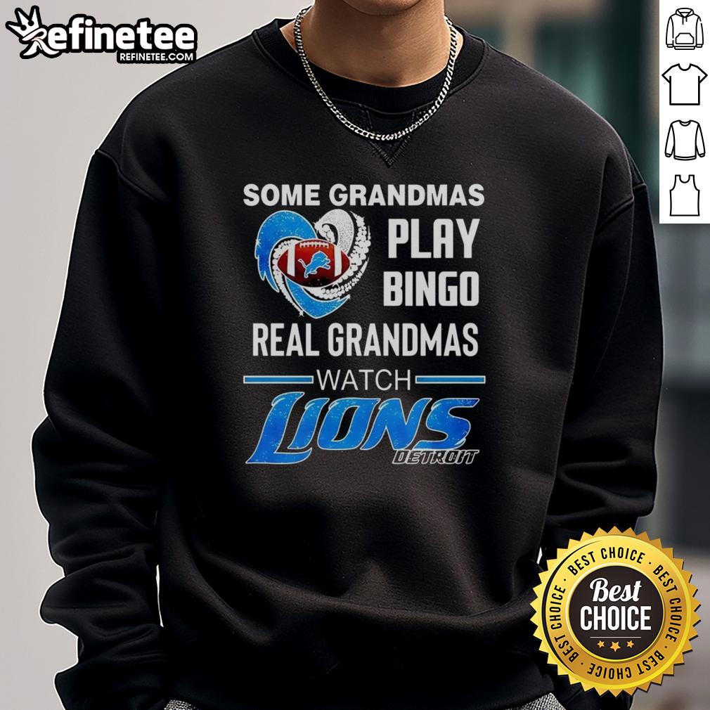 Alt Text: Official sweatshirt reading 'Some Grandmas Play Bingo, Real Grandmas Watch Detroit Lions Football' NFL apparel.