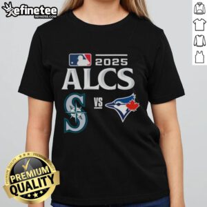 Official Toronto Blue Jays vs Seattle Mariners 2025 ALCS Baseball Matchup Ladies Tee showcasing team logos and vibrant colors.