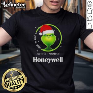 Alt Text: Funny Grinch Christmas T-Shirt with 'I Used To Smile And Then I Worked At Honeywell' slogan for holiday humor.