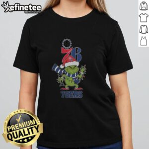 Original Philadelphia 76ers Christmas Grinch Santa Hat Holiday 2025 Ladies Tee featuring festive design and team logo.