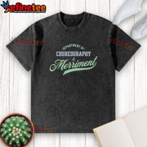 Premium Department of Choreography and Merriment washed t-shirt displayed on a wooden background, showcasing its vibrant design.