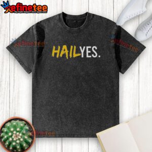 Premium Hail Yes Michigan Wolverines Football washed t-shirt featuring team logo and vibrant colors for fans.