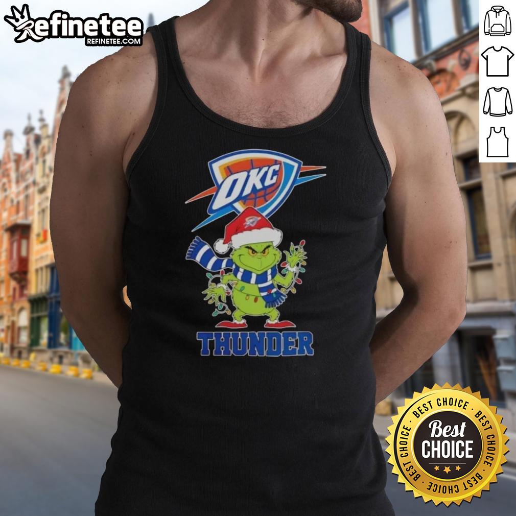 Pretty Oklahoma City Thunder Christmas Grinch Santa Hat holiday tank top worn by a smiling fan at a festive event.