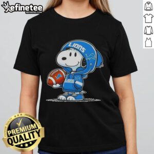 Snoopy in a Detroit Lions hoodie smiling at fans, featured on an awesome ladies tee with peanuts design.