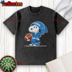 Snoopy in a hoodie, smiling at fans on a washed Detroit Lions t-shirt, showcasing awesome Peanuts character design.