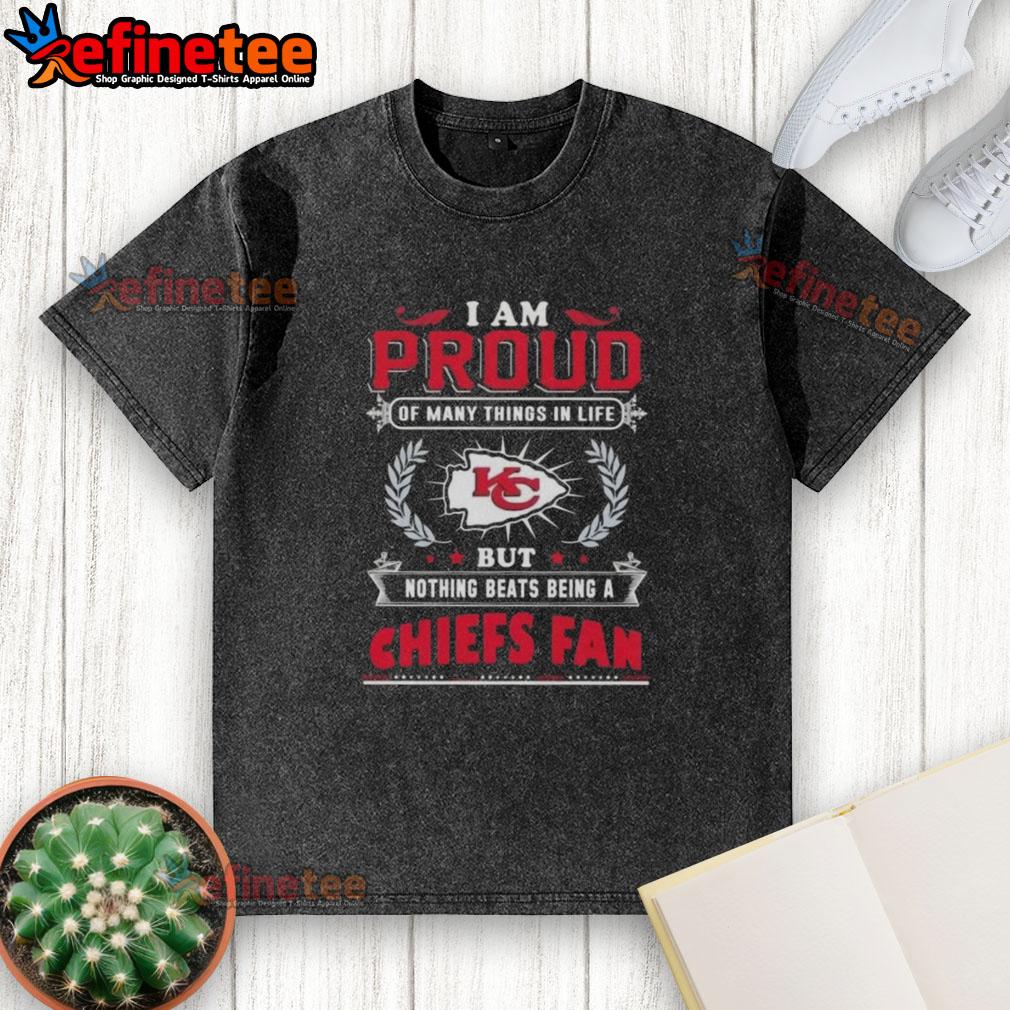 Proud Kansas City Chiefs fan wearing a washed t-shirt celebrating their love for the team and football culture.