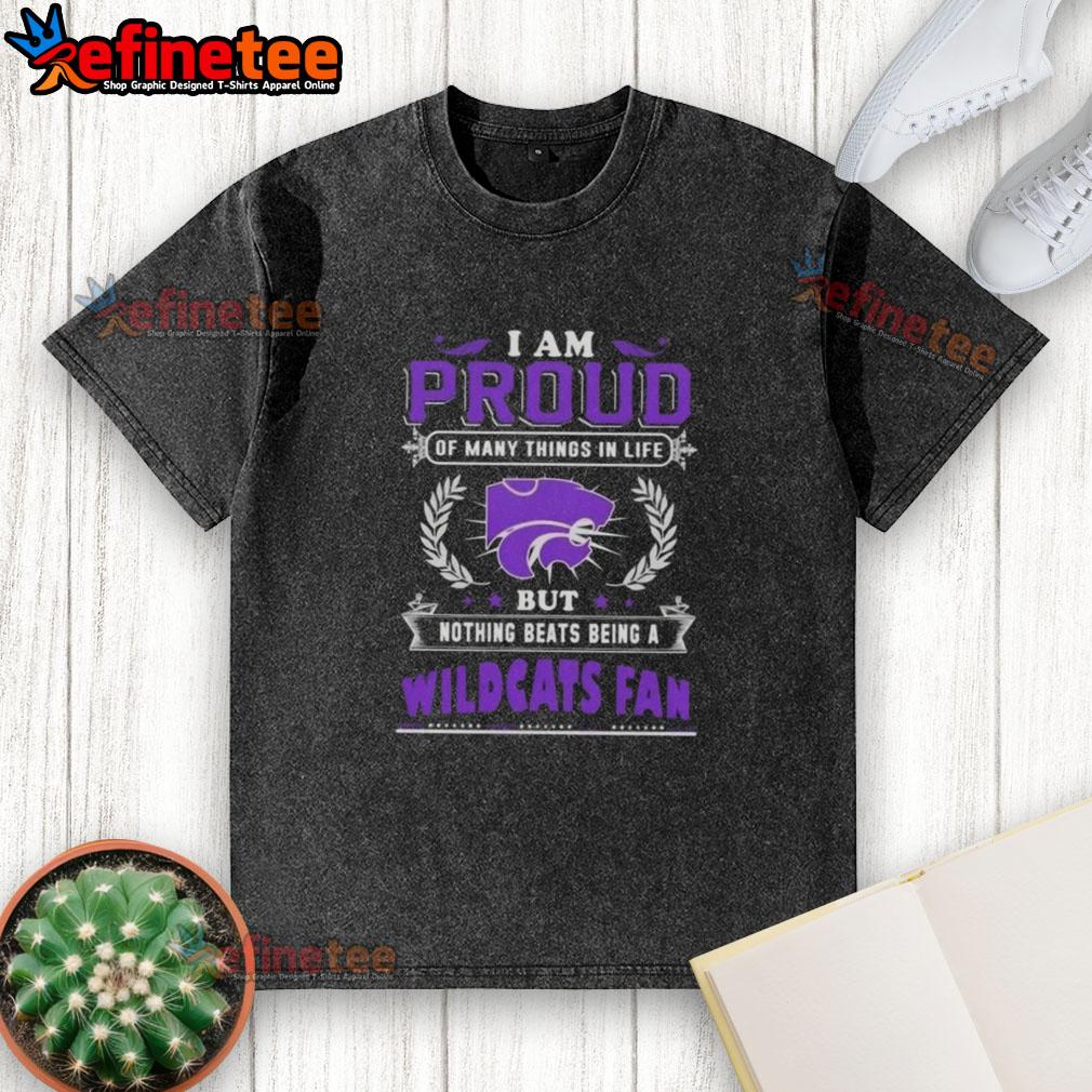 Alt Text: Kansas State Wildcats fan proudly wearing a washed T-shirt that says 'I am proud of many things in life.'