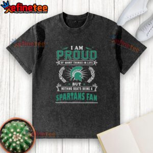 Washed t-shirt featuring 'Proud Michigan State Spartans Fan' text, showcasing Spartan pride and team spirit.