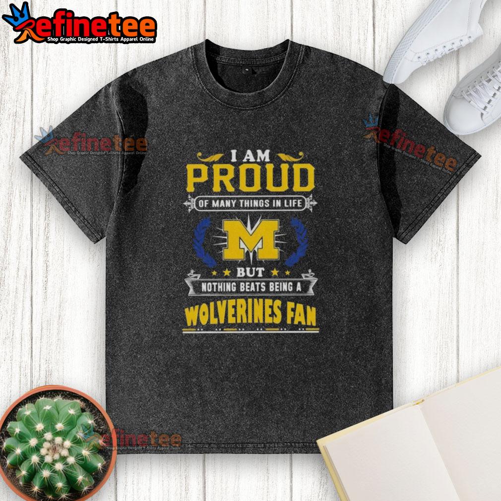 Michigan Wolverines fan proudly wearing a washed t-shirt, showcasing team spirit and love for college football.
