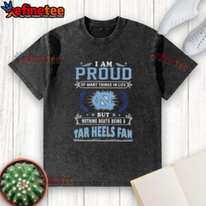 North Carolina Tar Heels fan proudly wearing a washed t-shirt showcasing their love for the team and school spirit.
