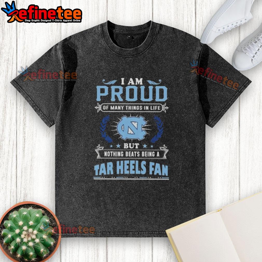 North Carolina Tar Heels fan proudly wearing a washed t-shirt showcasing their love for the team and school spirit.