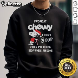 Alt Text: Cozy Christmas sweatshirt featuring Snoopy with the slogan I Work At Chewy, I Dont Stop When Im Tired.
