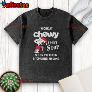 Funny Snoopy Christmas t-shirt with 'I work at Chewy, I dont stop when Im tired, I stop when Im done' slogan.