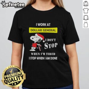 Christmas Ladies Tee featuring Snoopy with the phrase 'I work at Dollar General, I don't stop when I'm tired'.
