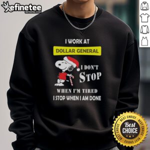 Alt Text: Snoopy Christmas sweatshirt featuring 'I work at Dollar General, I don't stop when I'm tired, I stop when I'm done.'