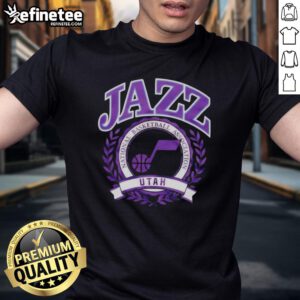 Alt Text: Stylish Utah Jazz NBA crest t-shirt featuring team colors and logo for fans of the National Basketball Association.