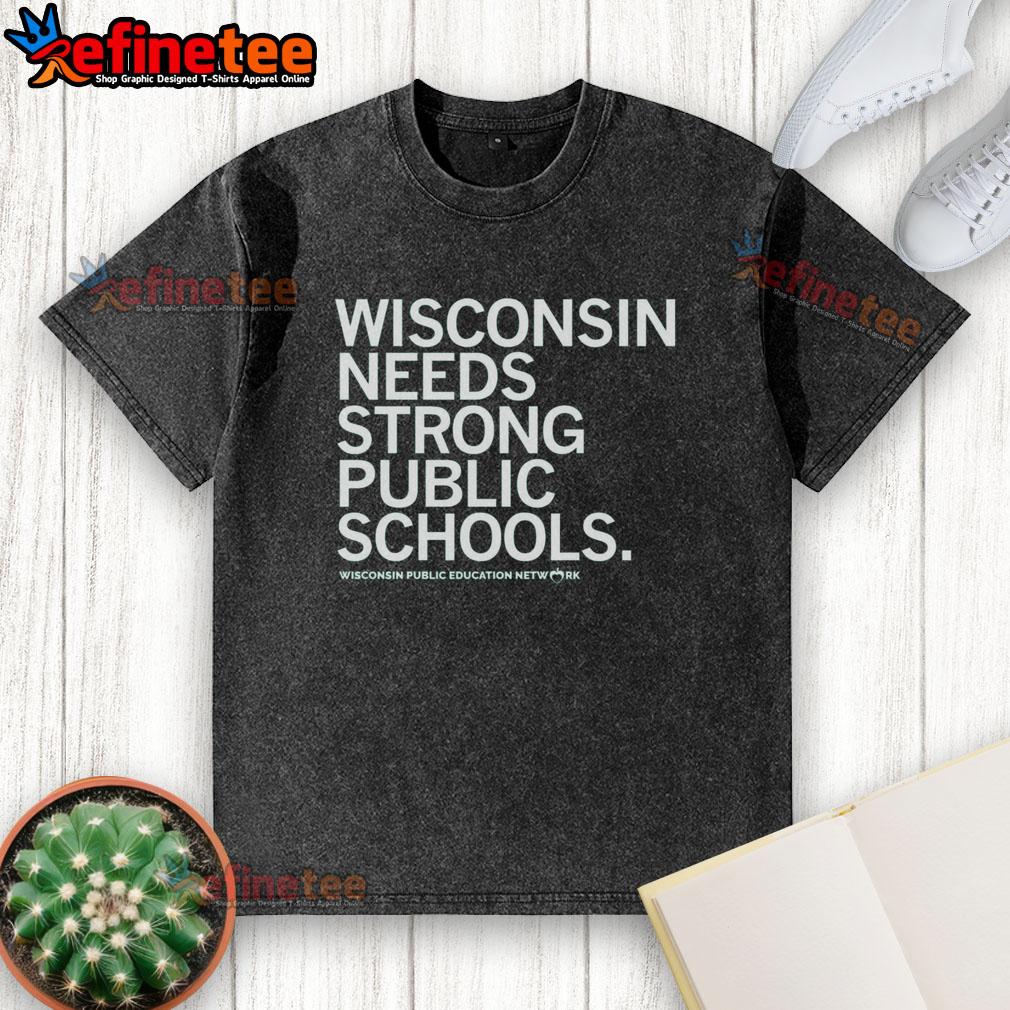 Nice Wisconsin Needs Strong Public Schools washed t-shirt displayed on a rustic wooden background.