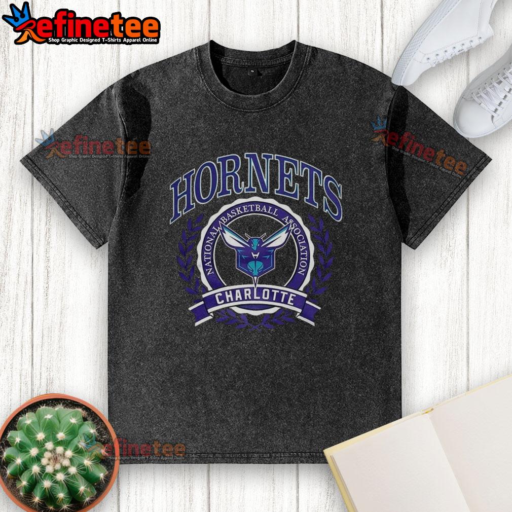 Alt Text: Official Charlotte Hornets NBA logo in a laurel wreath frame on a retro washed t-shirt, showcasing team pride.