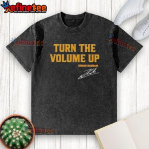 Alt Text: Official Donald Trump 'Turn The Volume Up' signature washed t-shirt featuring bold graphics and a comfortable fit.